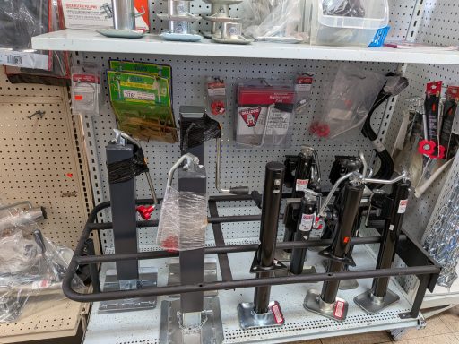 jacks Display of various hardware tools and accessories on a retail shelf.